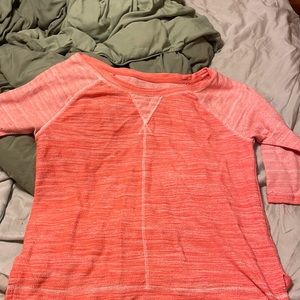 Light orange long sleeve women’s top